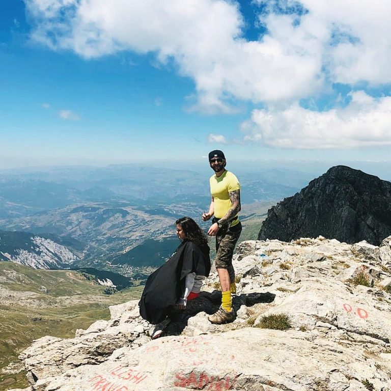 cutting hair in the highest peak of Korab mountain in Albania